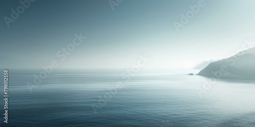 b'Foggy seascape with distant mountains'