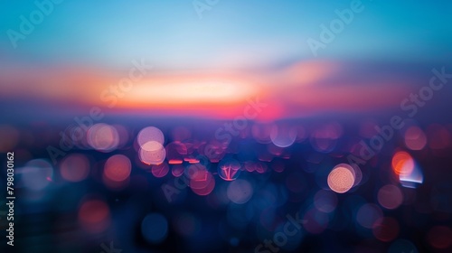 Defocused The bustling city lights blur and smear together creating an otherworldly distortion as the last rays of daylight vanish into the dusk sky. . photo