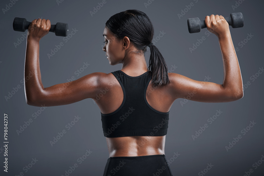 Fitness, training and woman with dumbbells, studio and gym for workout, sport and wellness in mockup. Background, sportswear and goals for body, exercise and healthy with club, athlete and girl Fitness, training and woman with dumbbells, studio and gym for workout, sport and wellness in mockup. Background, sportswear and goals for body, exercise and healthy with club, athlete and girl
