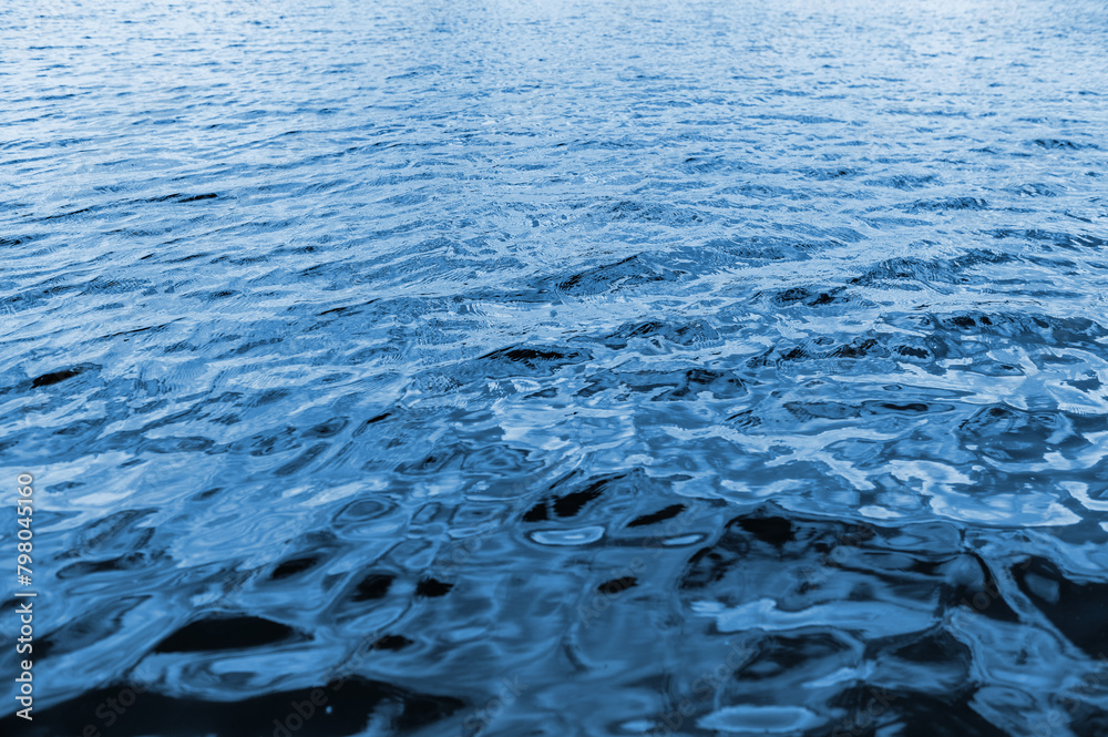 Sea surface. Blue water texture. Close up blue water surface Sea surface. Blue water texture. Close up blue water surface