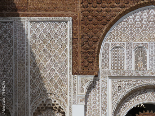 UNESCO World Heritage. Medersa Ben Youssef (16th century). Details of the walls decorated by plasterwork in the courtyard. Marrakech. Maroc. photo