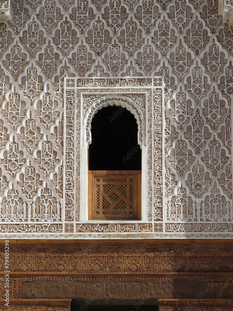 UNESCO World Heritage. Medersa Ben Youssef (16th century). Details of the walls decorated by plasterwork in the courtyard. Marrakech. Maroc.