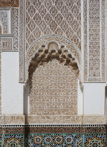 UNESCO World Heritage. Medersa Ben Youssef (16th century). Details of the walls decorated by plasterwork in the courtyard. Marrakech. Maroc. photo