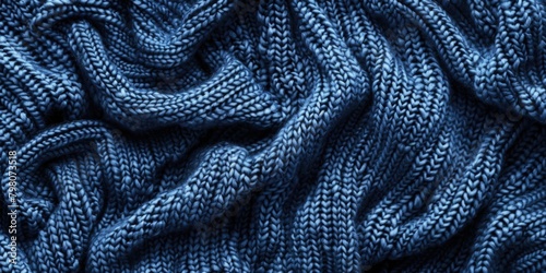 A detailed view of a cozy blue knitted blanket, perfect for home decor projects