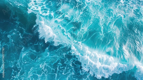 Ocean waves roll onto sandy beach, captured in panoramic aerial view with space for text