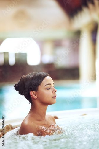 Woman  hot tub and relax calm at spa hotel for stress relief treatment or hydrotherapy  resort or hospitality. Female person  jacuzzi and lodge accommodation in Miami or hygiene  resting or travel
