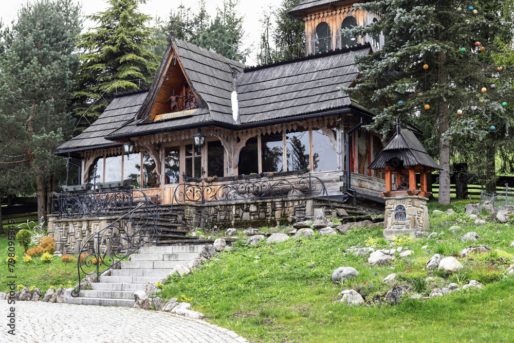 WITOW, POLAND - APRIL 19, 2024: .Historic wooden church and its surroundings in Witow, Poland.