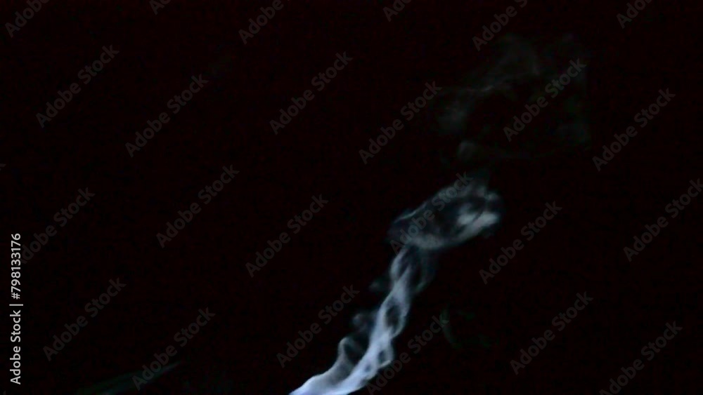 white steam rises and spins from the pressure cooker. swirl vapor of cooking. thick smoke rises from hot aliment on black background white steam rises and spins from the pressure cooker. swirl vapor of cooking. thick smoke rises from hot aliment on black background