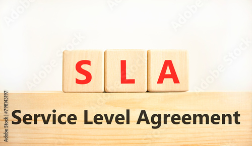 SLA service level agreement symbol. Concept words SLA service level agreement on beautiful wooden blocks. Beautiful white background. Business SLA service level agreement concept. Copy space.