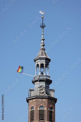Rainbow flag on a church bell tower in Amsterdam, Holland