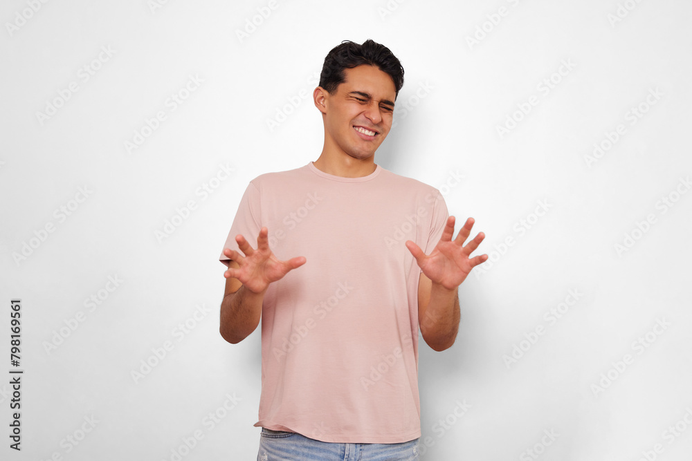 young man showing satiety and a little disgust