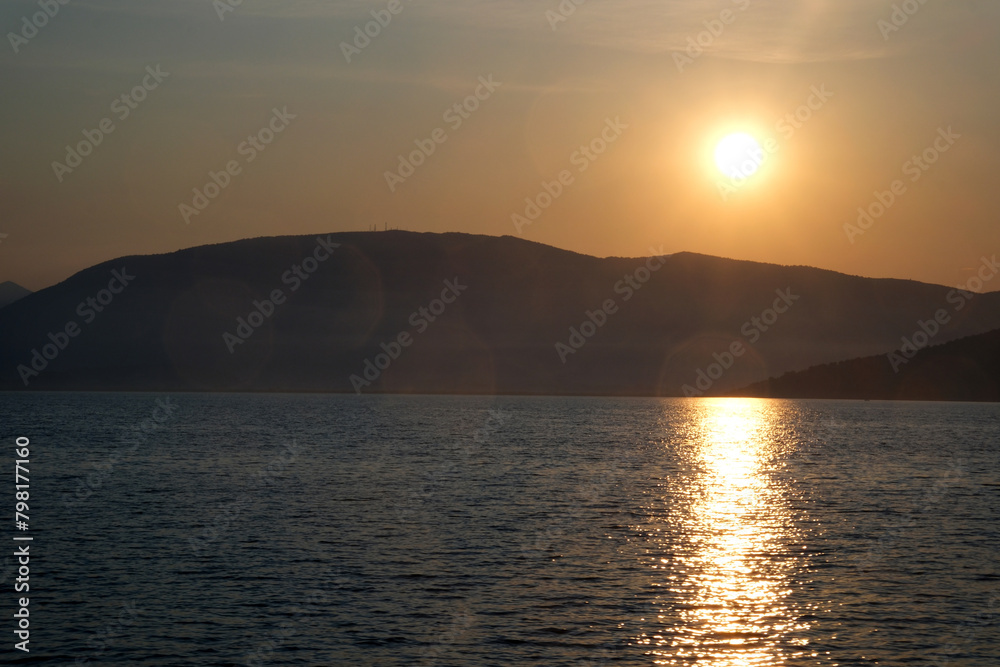 Sunset on the island of Evia, Greece. Beautiful golden sunset hour at sea