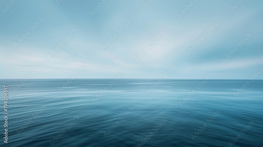 Obraz premium A hazy ocean horizon blends into an endless sky bringing to mind the serenity and freedom of a seaside getaway from the fastpaced modern world. .