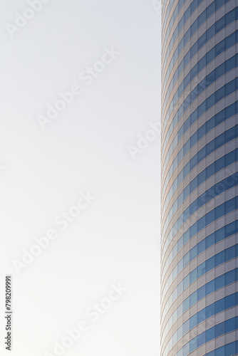 Facade of a modern and generic office skyscraper building seen from the side, copy space.