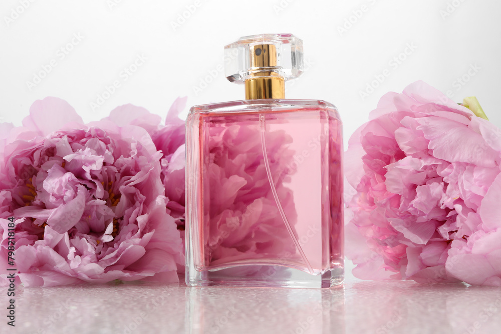 Luxury perfume and floral decor on plastic surface Luxury perfume and floral decor on plastic surface
