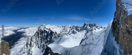 Haute-Savoie, France, 04-25-2024: off ski slope from L’Aiguille du Midi (Needle at midday), the highest spire (3.842 m) of the Aiguilles de Chamonix in the northern part of the Mont Blanc massif