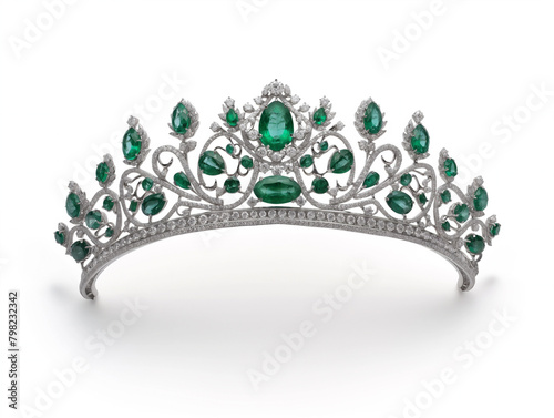 Gold color fashion crown with green gemstones on white.background Golden diadema royalty jewelry