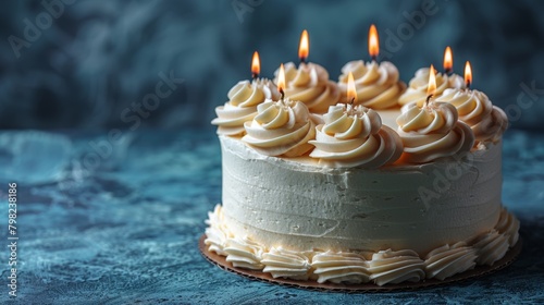 Cake With White Frosting and Lit Candles
