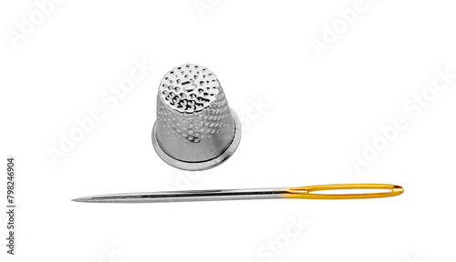 Needle and thimble  on a white