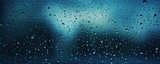 Raindrops on window with abstract background.