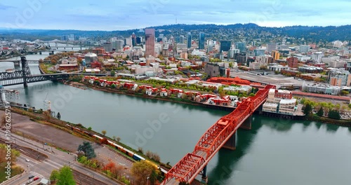 The Broadway Bridge, a bascule bridge over the Willamette River in Portland, Oregon, United States. Top view on the other bridges above the river and beautiful cityscape at sunset. photo