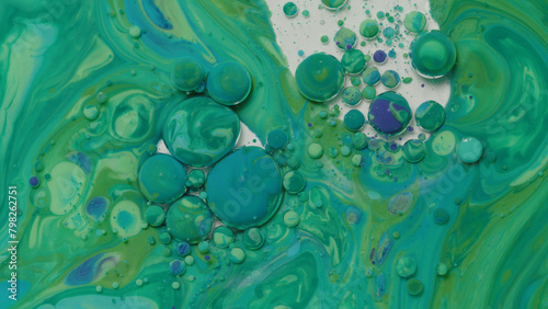 Various colors of paint mixing with mineral oil and dish soap