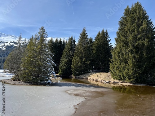 A typical winter idyll on the frozen and snow-covered alpine lake Heidsee (Igl Lai) in the Swiss winter resorts of Valbella and Lenzerheide - Canton of Grisons, Switzerland (Schweiz)