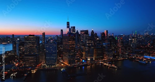 Beautiful city view with multiple lights on. New York panorama from drone footage above the East River. Aerial view.