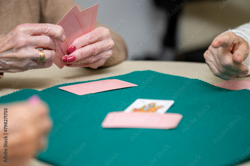 Active retirement, group of elderly women having fun playing cards game at nursing home. High quality photography. Active retirement, group of elderly women having fun playing cards game at nursing home. High quality photography.