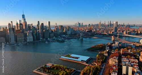 Panorama of Manhattan in New York, the USA. Aerial perspective on the metropolis in the light of setting sun.