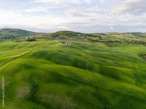 early morning with beautiful sunrise over the Val d'Orcia, countryside in Tuscany. Aerial view.