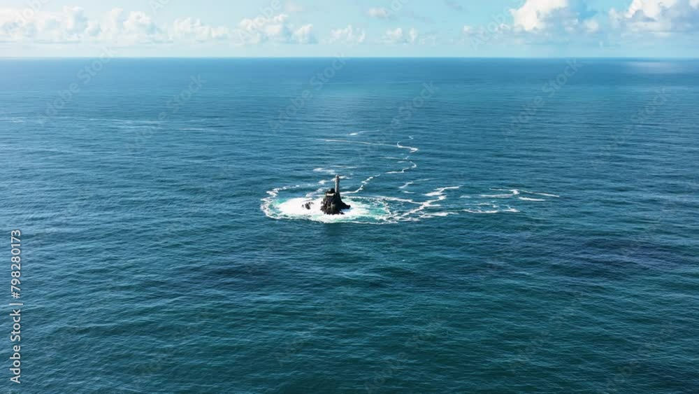 A lighthouse rising out of the ocean. Fastnet lighthouse 4k A lighthouse rising out of the ocean. Fastnet lighthouse 4k
