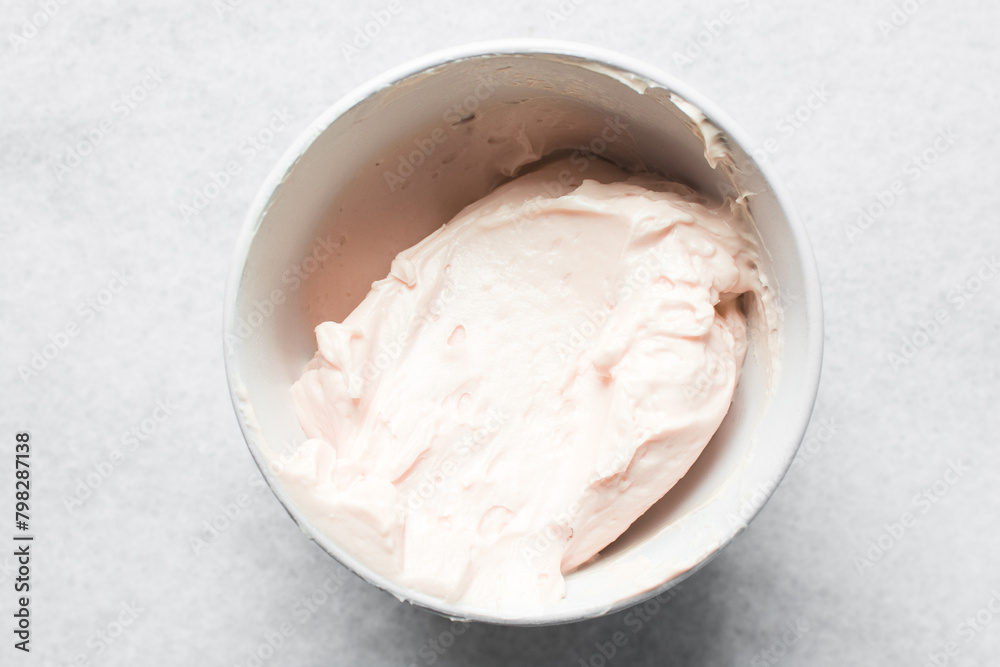 pink buttercream in a white mixing bowl, American buttercream in a bowl for icing cake, frosting for decorating cake pink buttercream in a white mixing bowl, American buttercream in a bowl for icing cake, frosting for decorating cake