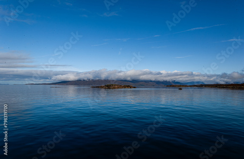 Blue Ocean scene with clear sky. Isle of Skye Scotland UK. Winter coastal landscape. Cold water