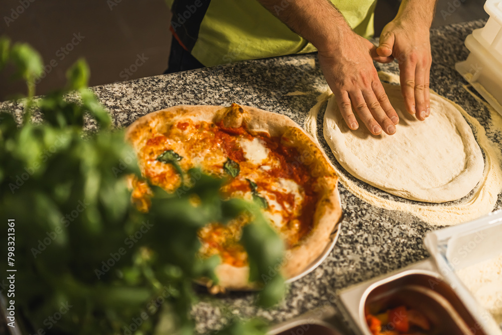 closeup of hands making pizza professionally, restaurant concept. High quality photo