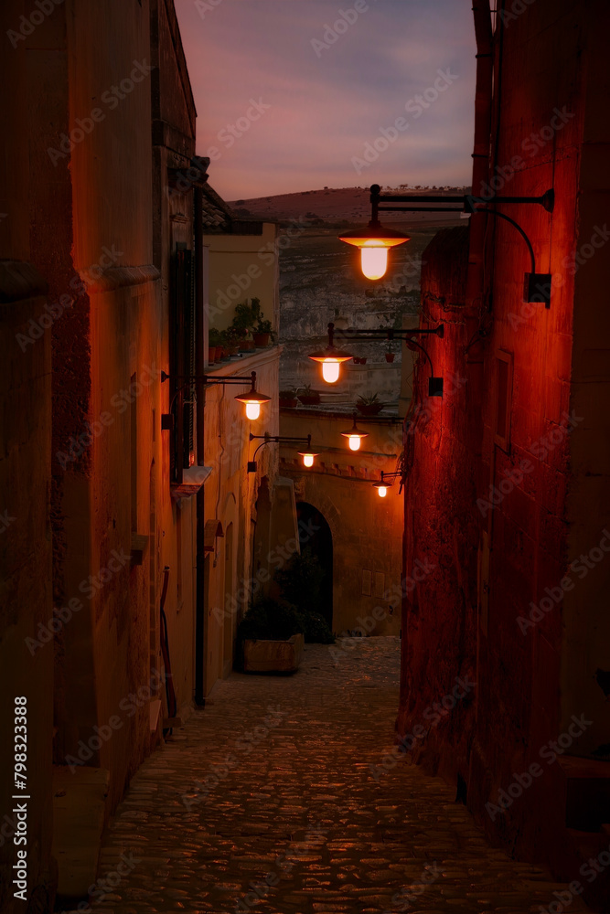 View from lamplit alleyway in Matera, Italy