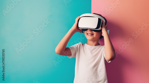 Little boy wearing virtual reality glasses on colorful background. Future technology concept. VR. Virtual reality concept with Copy Space.