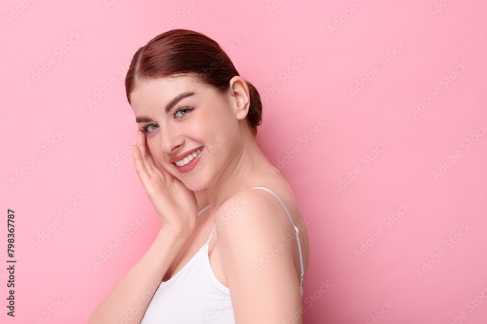 Portrait of smiling woman on pink background. Space for text Portrait of smiling woman on pink background. Space for text