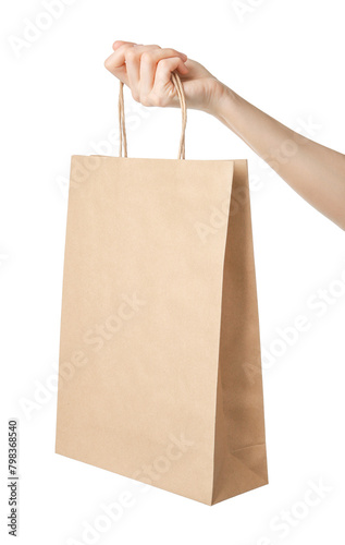 Woman holding kraft paper bag on white background, closeup. Mockup for design