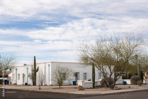 Exterior view from the street of a house on a corner in the Sam Hughes district of Tuscon, Arizona