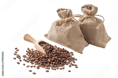 Coffee beans and scoop onto burlap bags isolated on white background.