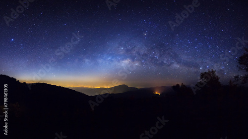Obraz na płótnie Panorama silhouette tree on high mountain with milky way galaxy, Night starry sky with stars w salonie