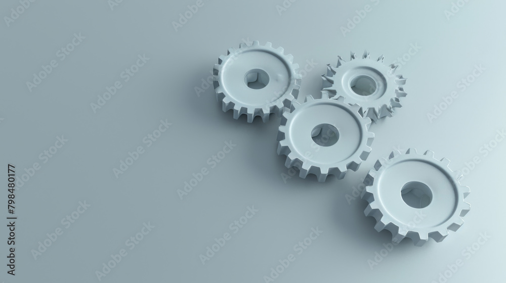 A clean and modern display of white gears on a smooth grey background, illustrating engineering concepts.