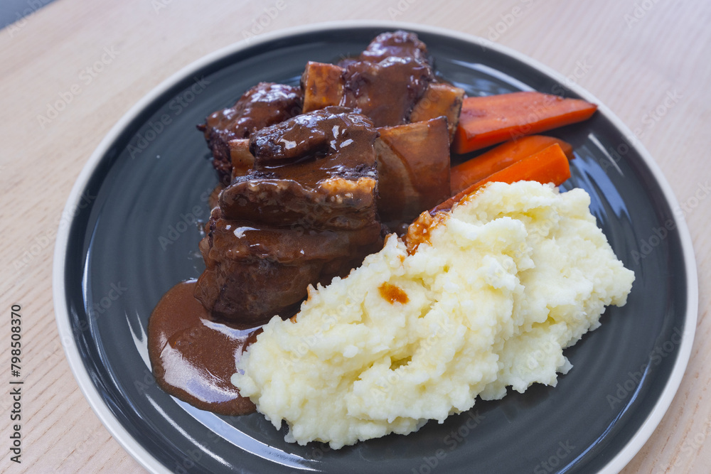Braised beef ribs with carrot and mash potato. Braised beef ribs with carrot and mash potato.