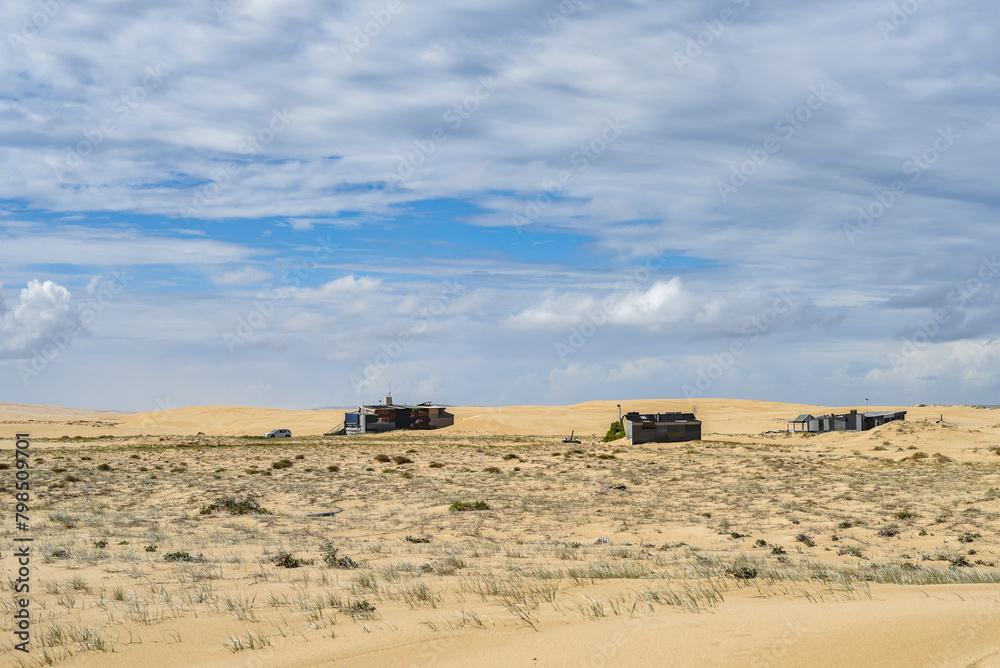 Walk through the sand dunes to Tin City Walk through the sand dunes to Tin City