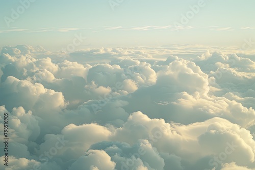 Serene Cloudscape: A High View of Nature's Aerial Splendor with Clear Blue Sky and White Clouds