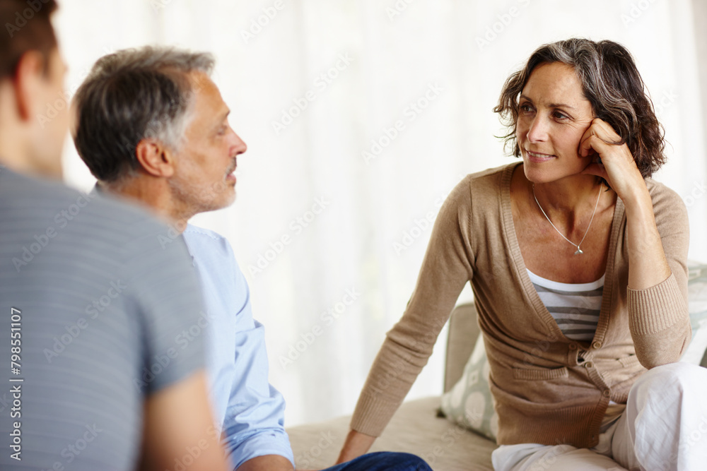 Mature couple, sofa and smiling in house living room with discussion, communication and decision. Man, woman and consultant for retirement fund, advice and counselling on investment or annuity plan