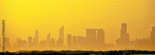 Sandstorm, samum, haboob over the southern megalopolis, the outline of skyscrapers are drowning in yellow haze. Abu Dhabi photo