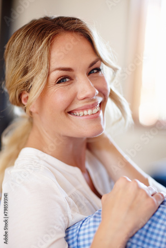 Woman, sofa and portrait with smile in home for relax, calm or recharge for wellness. Closeup, vacation or female person with happiness or laugh in house, joy for holiday in Manchester or England