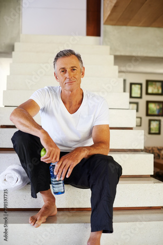 Mature man, portrait and stairs for workout, fitness and wellness for health and smile. Guy, apple and water for food, nutrition and hydration with diet happiness and training for cardio exercise